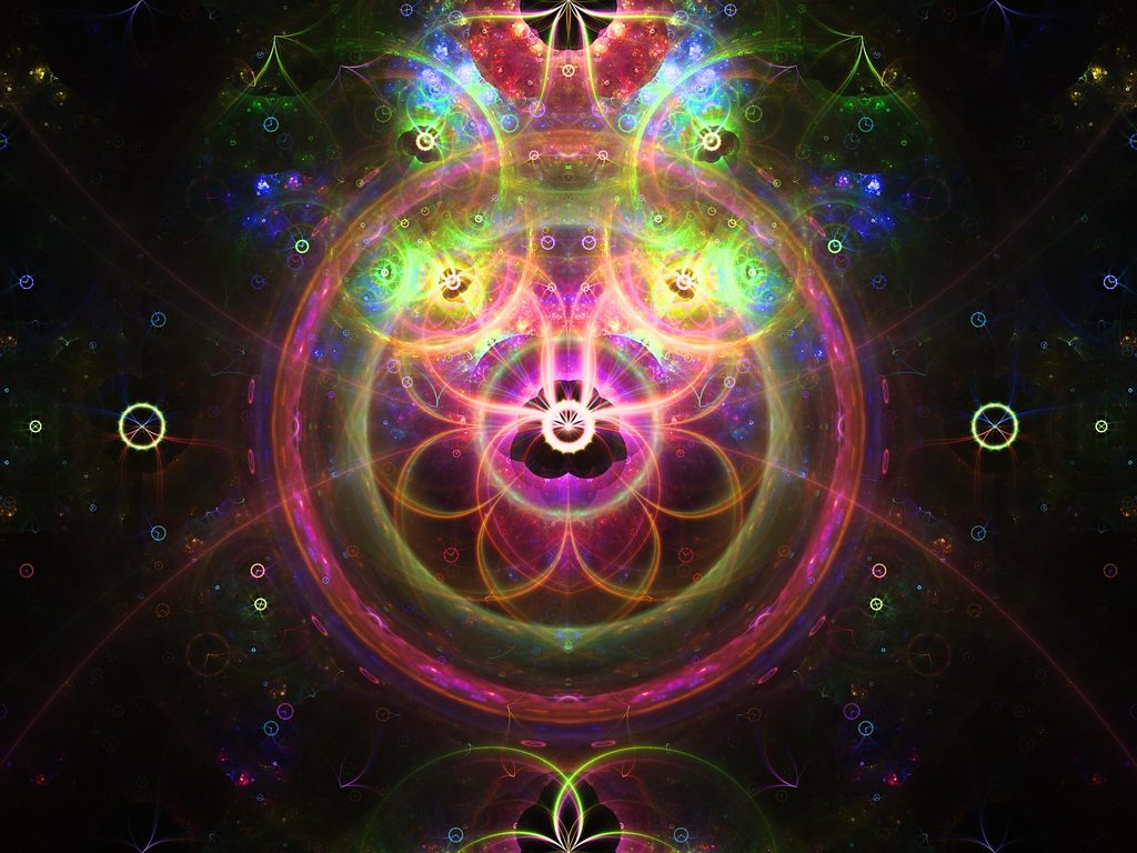 Vibrant symmetrical abstract digital artwork featuring luminous sacred geometry, glowing neon circles, fractal patterns, and cosmic light formations in vivid rainbow colors against a dark background, creating a mystical and energetic composition