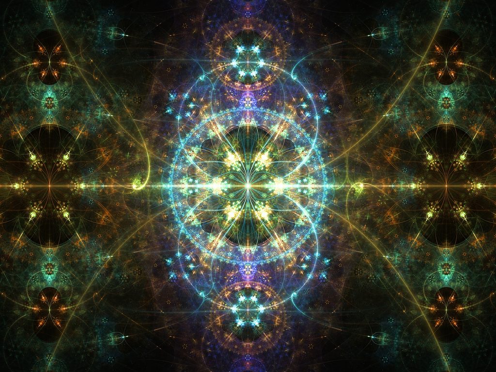 Intricate symmetrical fractal art with a glowing golden center, turquoise and blue geometric patterns, and cosmic details against a dark background.
